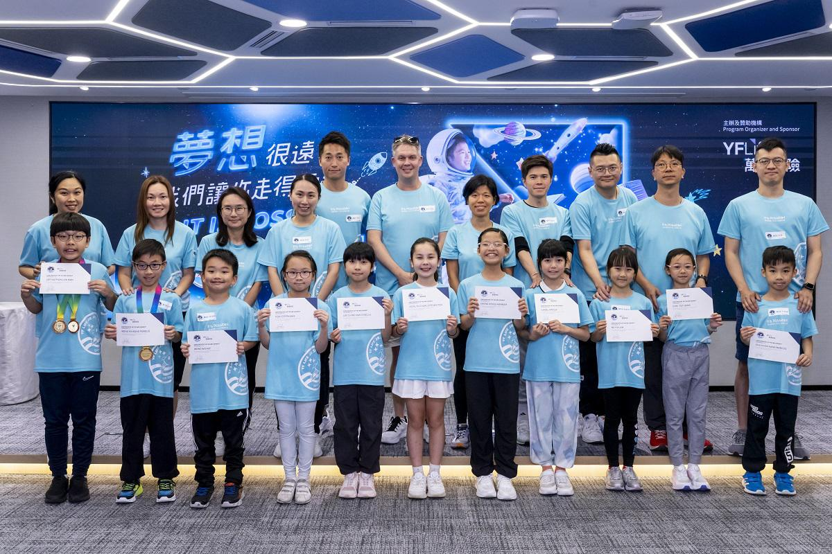 The 21 finalists pose for a group photo with their parents.